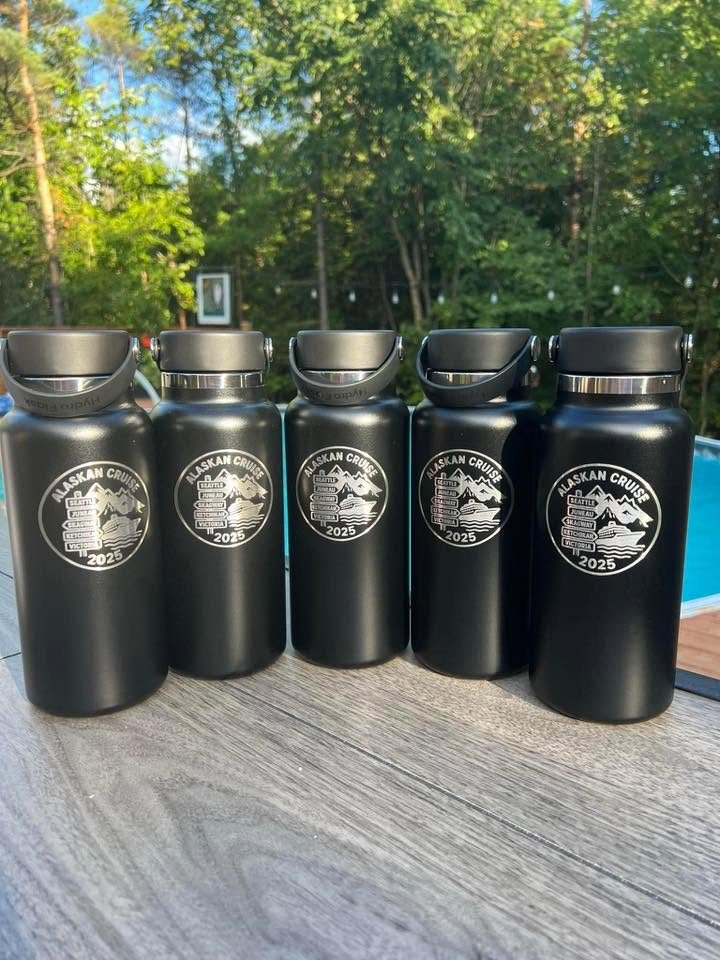 Black bottles engraved with Alaskan Cruise 2025 artwork