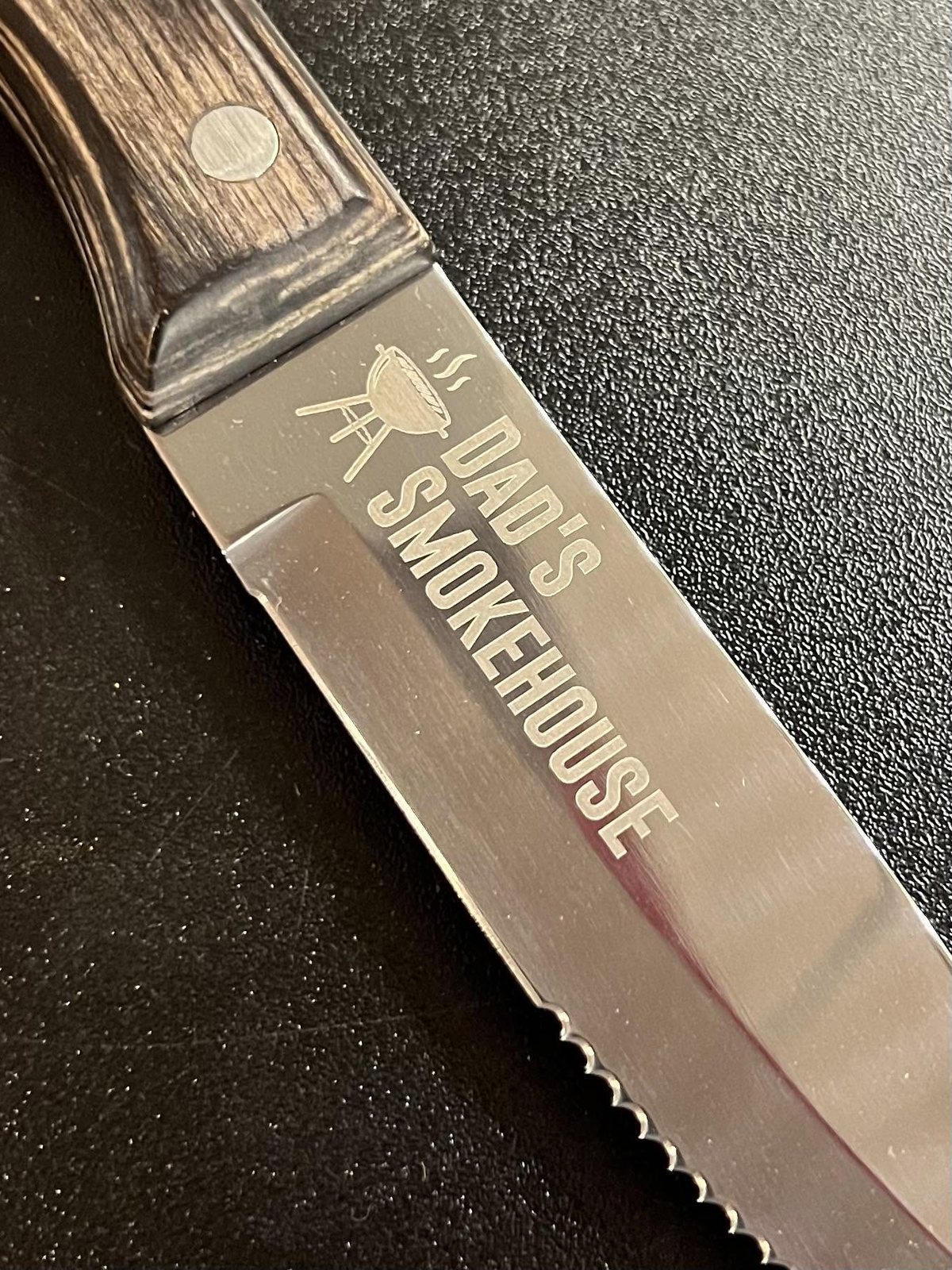 Stainless steak knife engraved with Dad's Smokehouse artwork